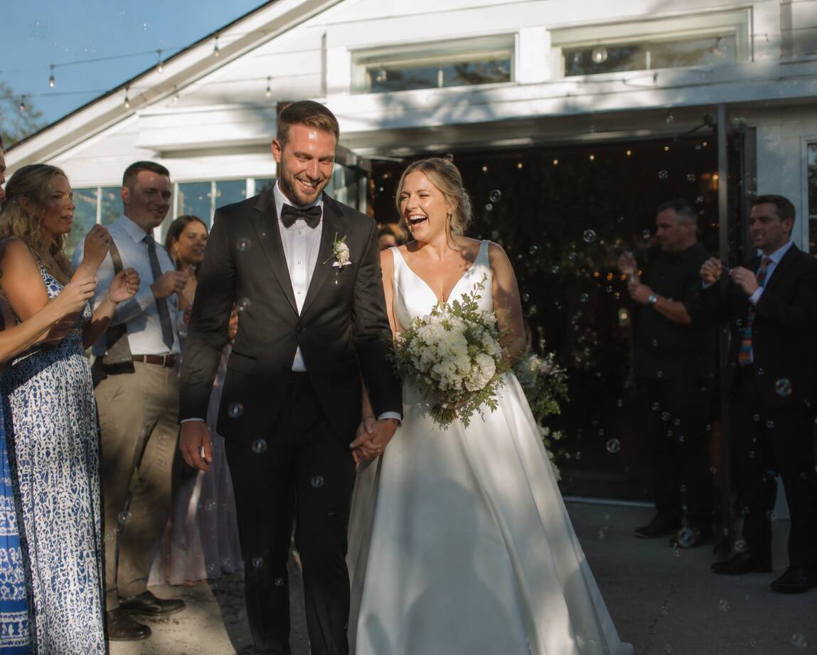 Wedding couple celebrating with their guests